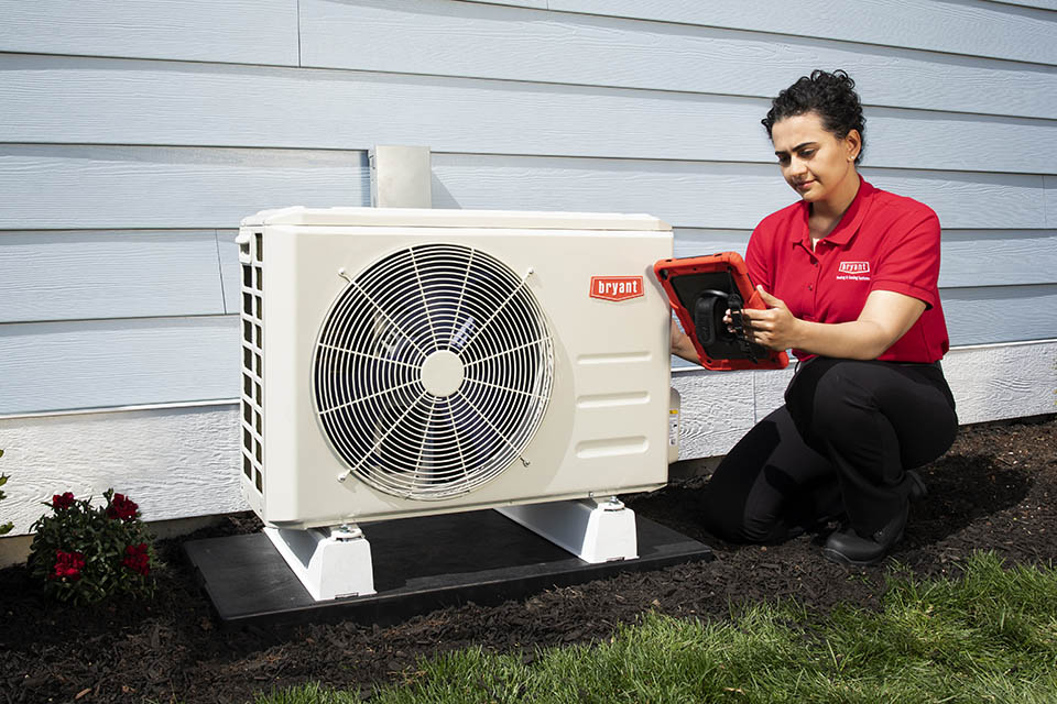 products-Bryant-MiniSplit-960×640 technician servicing a Bryant mini-split
